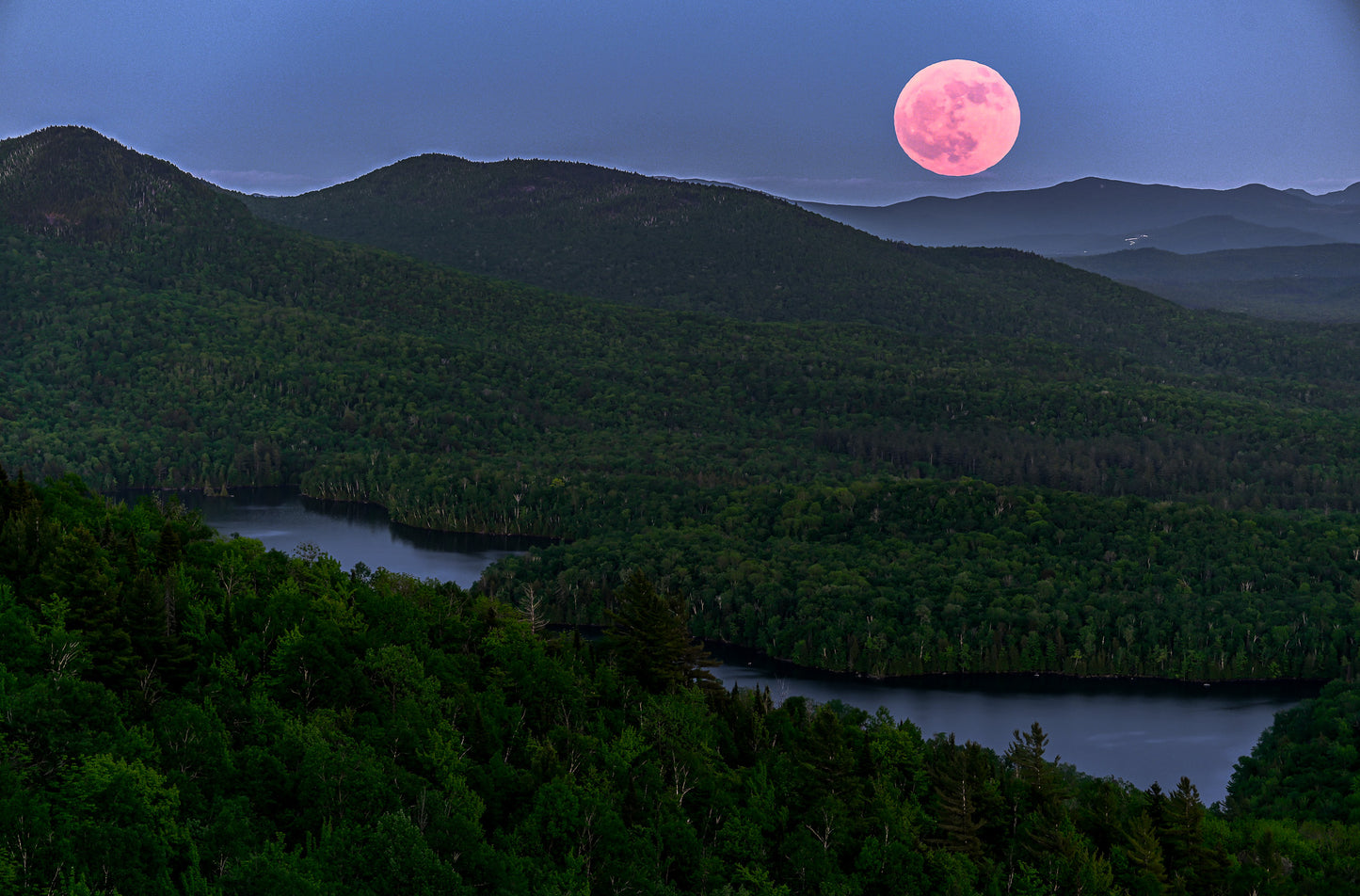 full moon over the Adirondack mountains
