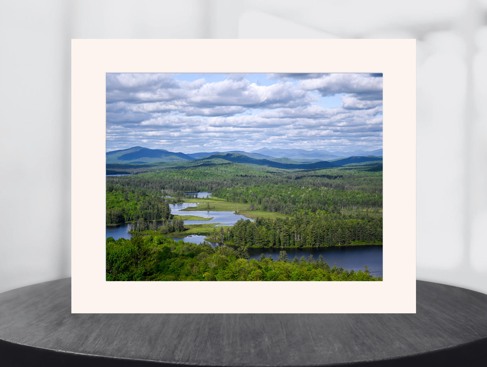 print of a river flowing through a meadow