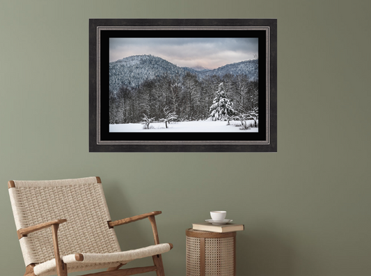 print of a field with snow covered trees and mountains