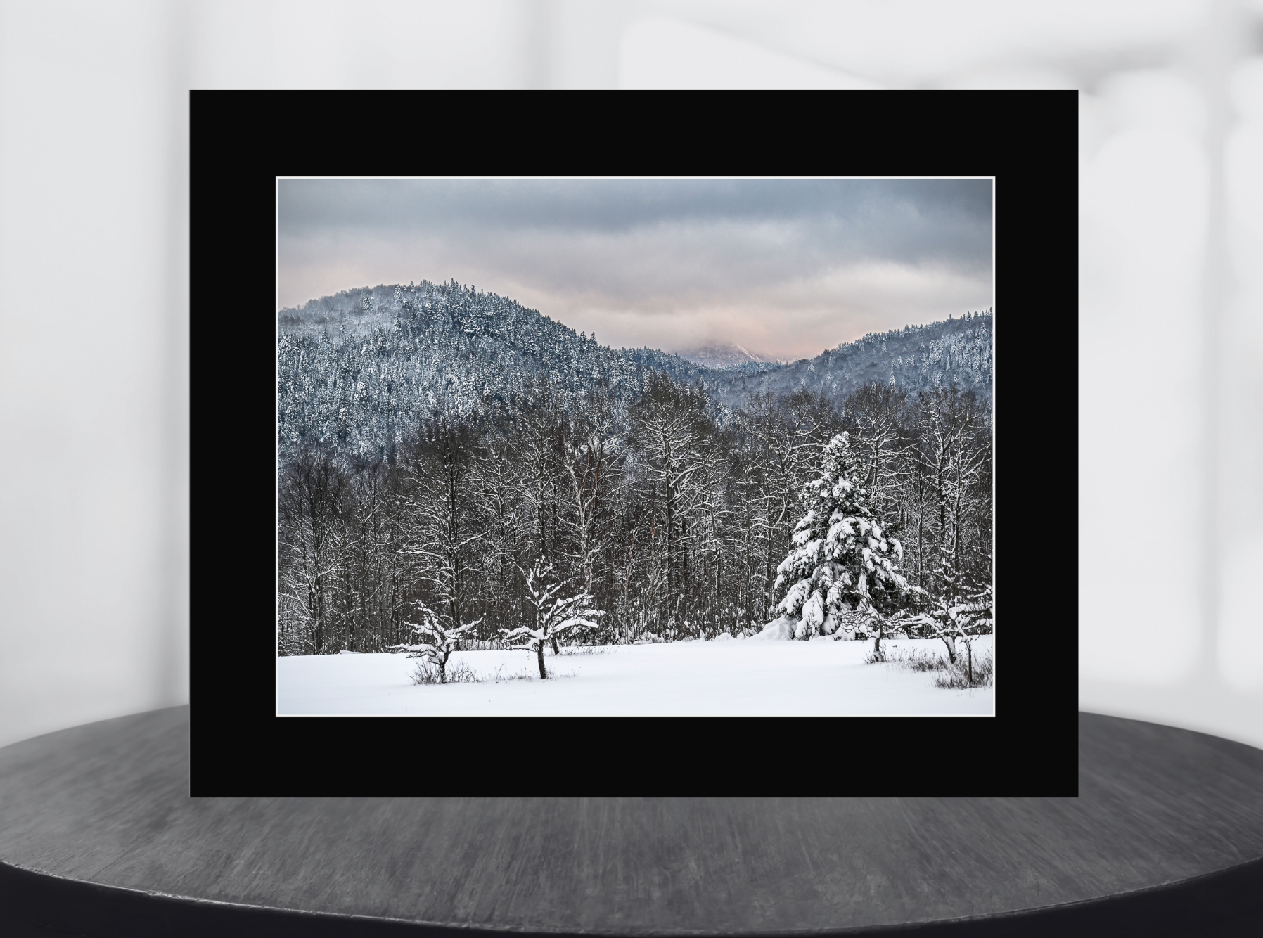 print of a field with snow covered trees and mountains