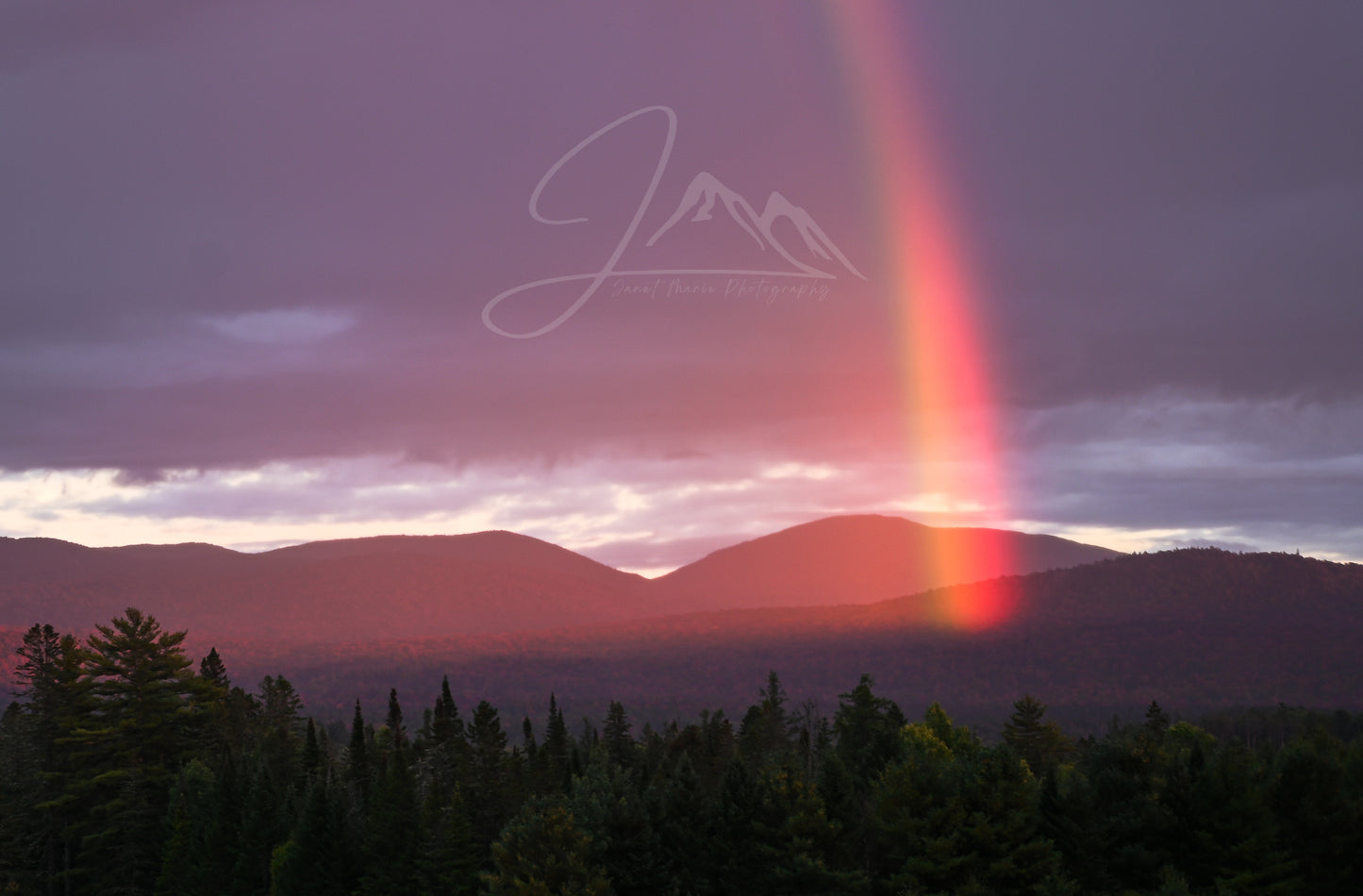 print of a rainbow and mountains