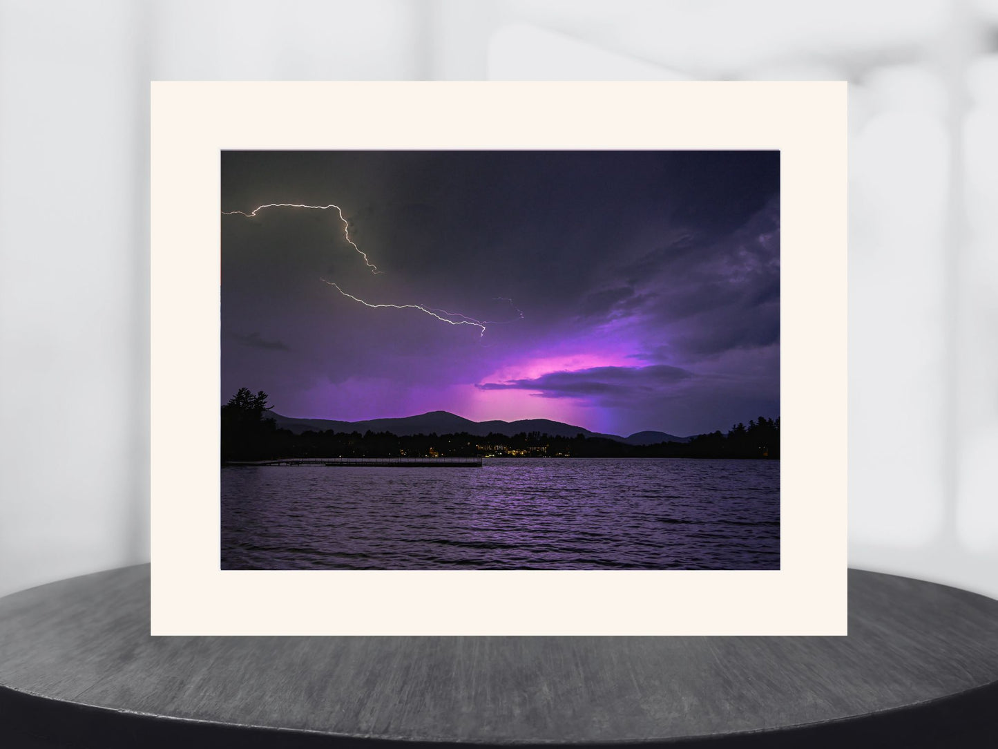 Nature's Dual Dance - Lightning and Aurora in the night sky over Mirror Lake in Lake Placid, New York.