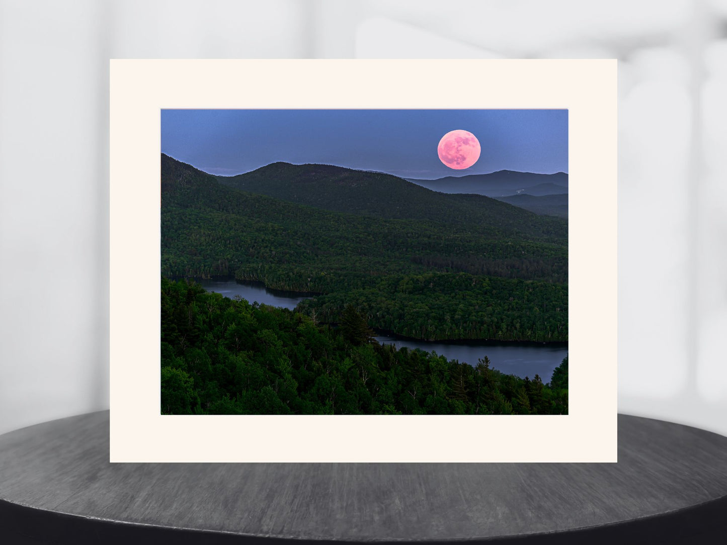 full moon over the Adirondack mountains